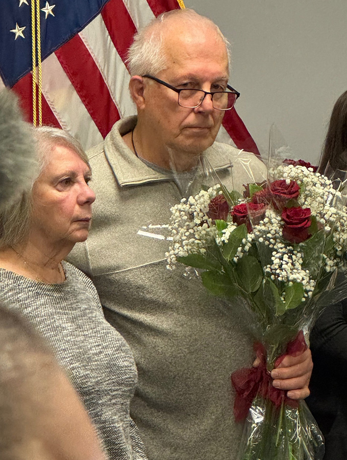 Joanne and Edwin Mack received flowers from families of other victims after the court hearing.